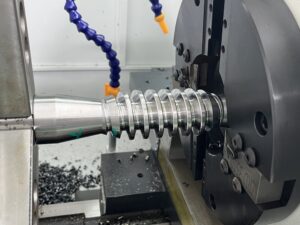 Close-up view of a metal rotor undergoing high-precision thread machining on the PH80 series Rotor Whirling Machine.