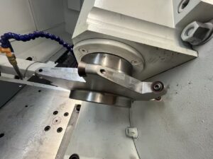 Detailed view of the specialized precision cutting tool ring and insert holders utilized on the PH80 series Rotor Whirling Machine for accurate thread profiling.