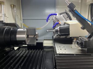Overview of the complete internal machining area showing the alignment of the workpiece chuck, grinding spindle, and dressing tool on the SMK1503 CNC Thread Grinding Machine.