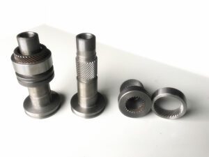 A display of several complex metal parts machined with high precision by the PH46-750 CNC Rotor Whirling Machine These parts feature a high surface finish and intricate details, highlighting the machine's advanced manufacturing capabilities