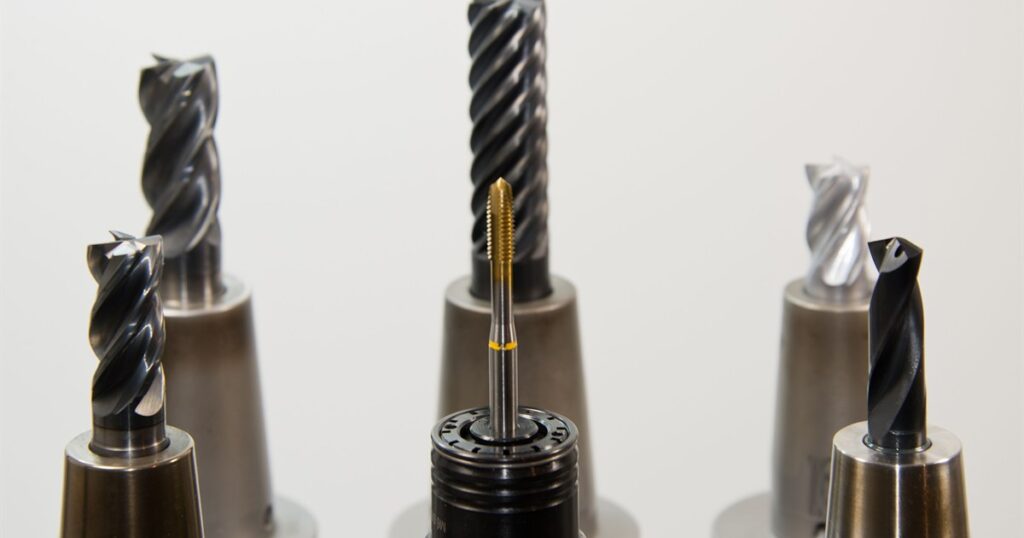 Close-up of thread cutting tools used with a CNC whirling machine in industrial thread machining
